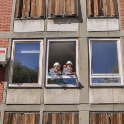 Two workers talking on the window